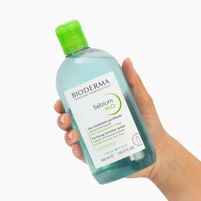 Bioderma Sébium H2O 500ml held in hand — official brand photo
