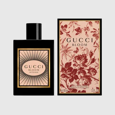 Gucci Bloom Intense 100ml black bottle beside its red Toile de Jouy box — official brand image